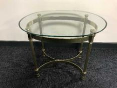 A contemporary glass top coffee table