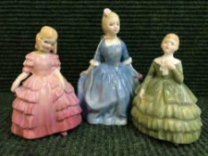 Three Royal Doulton figures - A child from Williamsburg HN 2154 and two other Doulton figures