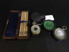 Two pocket compensated barometers, in original cases,