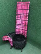 A contemporary high back chair