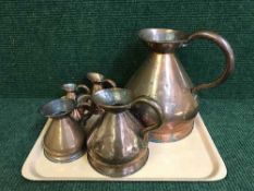 Six Victorian copper jugs