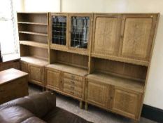 A continental triple section carved oak wall unit