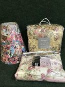 An Eastern style rug, cotton quilted throw, duvet,