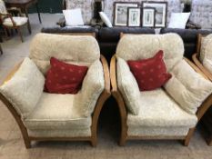 An Ercol two seater settee and matching pair of armchairs