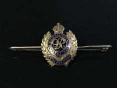 A 9ct gold and enamel Royal Engineer's bar brooch with emblem, in fitted tooled leather box, 4.