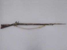 A George III flintlock Brown Bess musket,