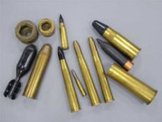 Twelve assorted defunct brass shells, including two compressed trench art examples,