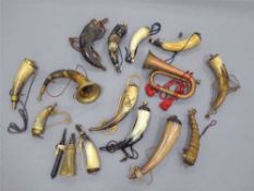 A collection of fourteen horn powder flasks,