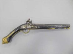 An 18th century and later flintlock holster pistol, the lockplate stamped LONDON,