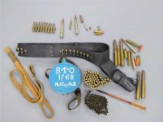 Militaria to include a quantity of defunct brass cartridges and shells, two bullet bandoliers,