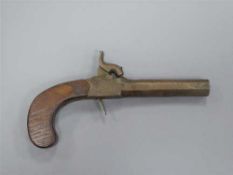 An early 19th century percussion cap pocket pistol, the octagonal 8cm barrel with proof marks,