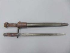 A WWI American Remington bayonet, the 43cm blade stamped 1917 and US below a flaming grenade,