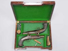A pair of early 19th century percussion cap pistols, the 15cm barrels octagonal at the breach,