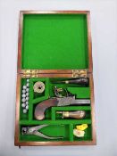 An early 19th century flintlock pocket pistol, the lockplate signed Rooke, Wigton, with a 3.