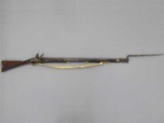 A George III flintlock India Pattern Brown Bess musket, the 100cm barrel with proof marks,