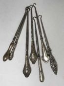 Seven Art Nouveau silver handled button hooks