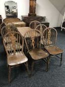 A 1920s oak gate leg table and seven Windsor style chairs