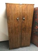 A three piece walnut bedroom suite