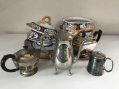 A tray of silver plated tea service,