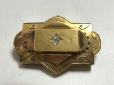 A very large 18ct gold diamond set brooch, 17.3g, central stone approximately 0.3ct.