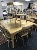 A rectangular pine pub table and four pine chairs