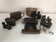 A box of binoculars and field specs,