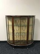 A 1950's walnut china cabinet