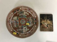 A Chinese cabinet plate and a hand painted wooden panel depicting Persian figures
