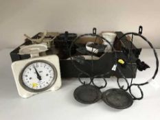 A box of vintage metal scales and weights