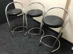 Three chrome bar stools