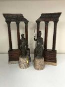 A pair of bronze classical style statues on marble bases and a pair of mahogany ormolu mounted