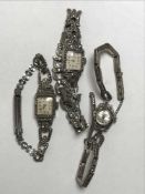 A silver marcasite wrist watch together with two other similar watches (3)