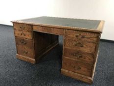 An Edwardian oak partner's desk