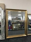 A gilt framed mirror