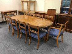 A walnut twelve piece dining room suite - break-front bookcase,