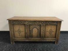 A contemporary oak blanket box