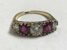 A fine 18ct gold ruby and diamond ring, the central stone approximately 1.1ct.
