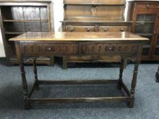 An oak two drawer side table
