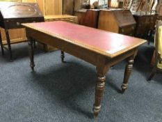 A Victorian oak writing table