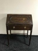 An early 20th century mahogany bureau