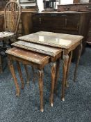 A nest of three walnut tables