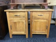 A pair of oak bedside stands