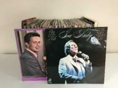 A large collection of singles and lps in three boxes - Elvis, Max Bygraves,