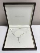 An 18ct white gold diamond set necklace