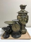 A tray of scales and weights and brass samovar