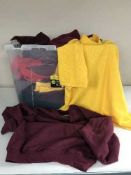 Three boxes of unused track suits and clothing