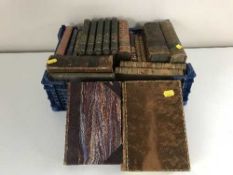 A crate of antiquarian leather bound books
