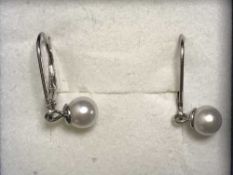 A pair of silver and freshwater pearl drop earrings