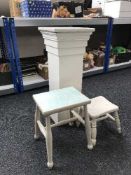 Two painted milking stools and a white column