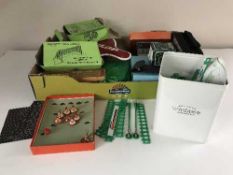 A box of subbuteo goal, match scorer, Bisley gun cleaning items,